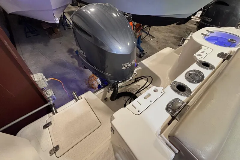 Slide: The Image of 2019 Sailfish 241 CC boat with Yamaha outboard motor in a showroom. - 43