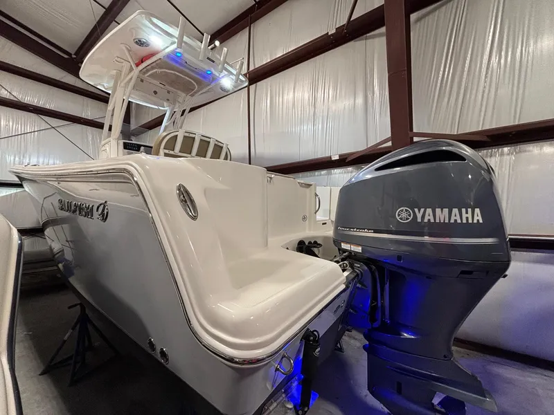 Slide: The Image of 2019 Sailfish 241 CC boat with Yamaha engine in indoor storage. - 5