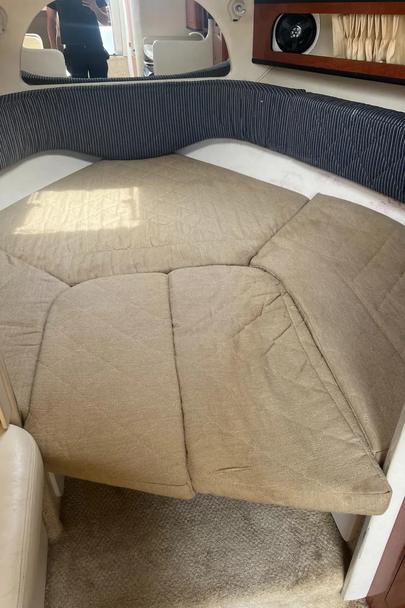 Slide: The Image of 2005 Sea Ray 280 Sundancer cabin interior with cozy bed and elegant design. - 19