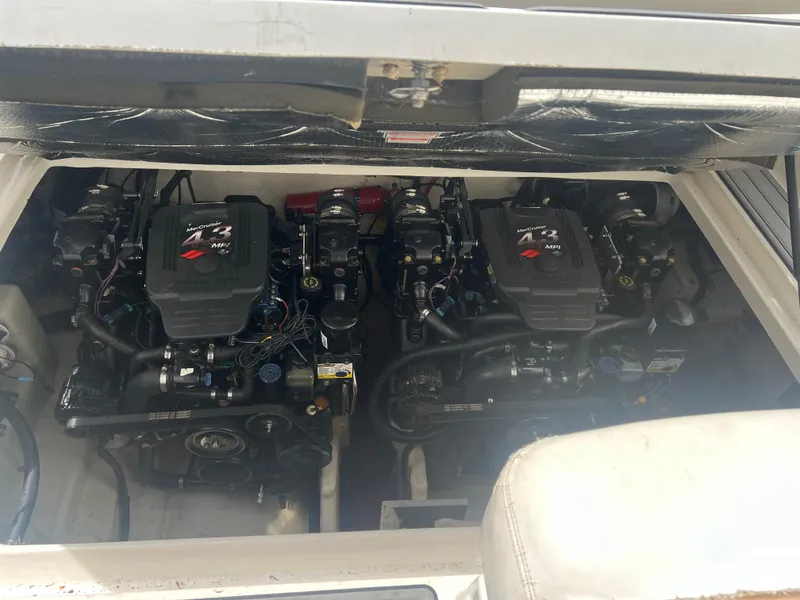 Slide: The Image of Twin engines of a 2005 Sea Ray 280 Sundancer boat, showcasing powerful marine engineering. - 22