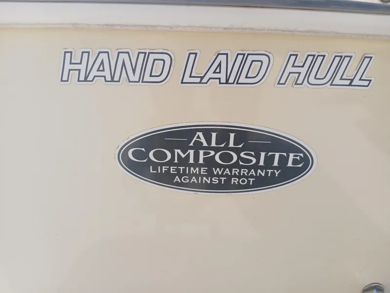 Slide: The Image of 2007 NauticStar 22 CC OS boat with hand-laid hull and all-composite lifetime warranty. - 12