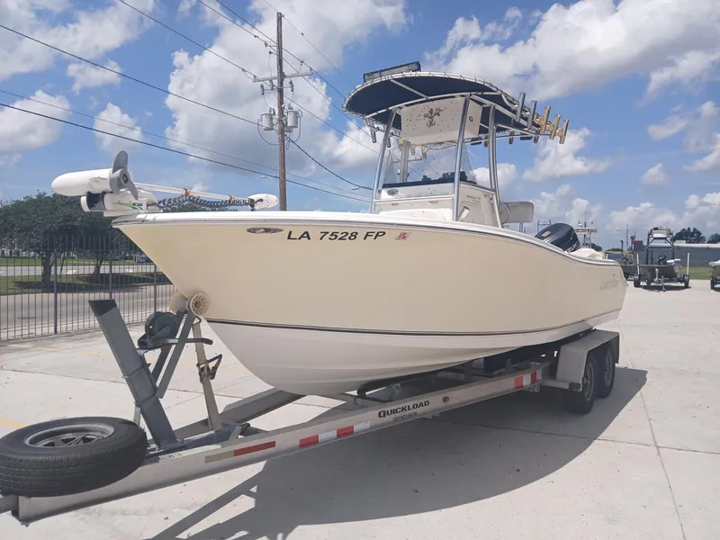 Slide: The Image of 2007 NauticStar 22 CC OS boat on trailer under blue sky. - 13