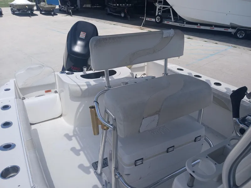 Slide: The Image of 2007 NauticStar 22 CC OS boat interior with seating and storage compartments. - 15