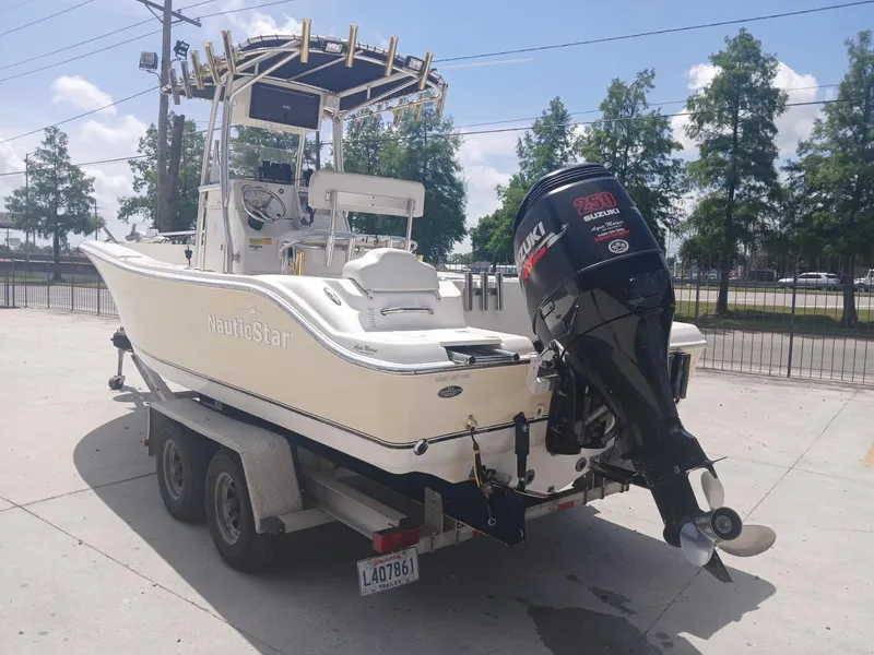 Slide: The Image of 2007 NauticStar 22 CC OS boat on trailer with Suzuki 250 outboard motor. - 3
