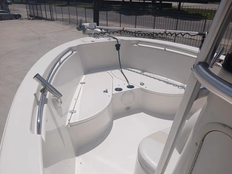 Slide: The Image of 2007 NauticStar 22 CC OS boat deck with seating and railing in sunlight. - 6