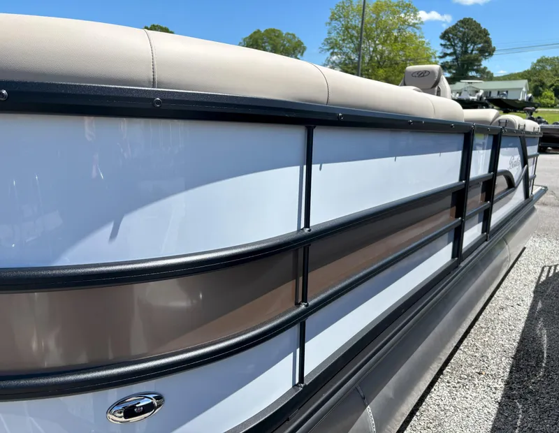 Slide: The Image of 2025 Bentley Pontoons Legacy 223 Navigator, sleek design, side view, parked outdoors. - 15