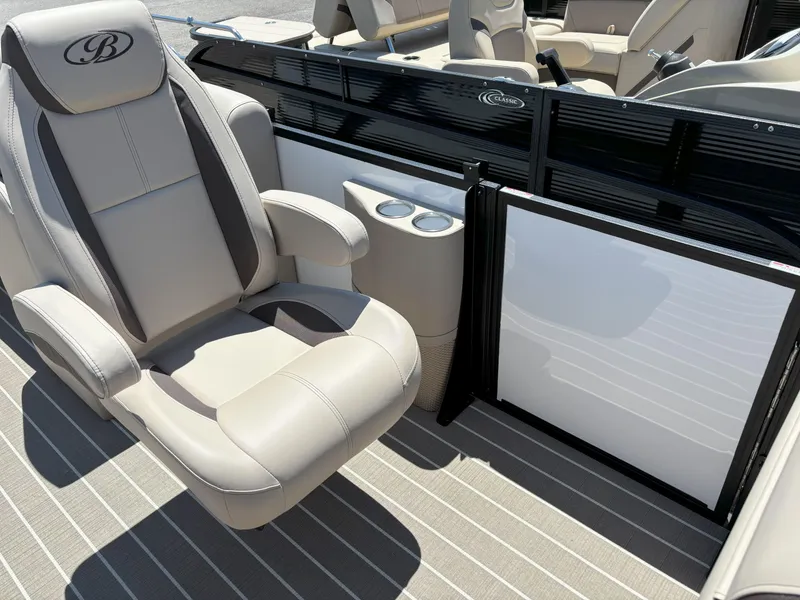 Slide: The Image of 2025 Bentley Pontoons Legacy 223 Navigator interior with luxurious seating and cup holders. - 18