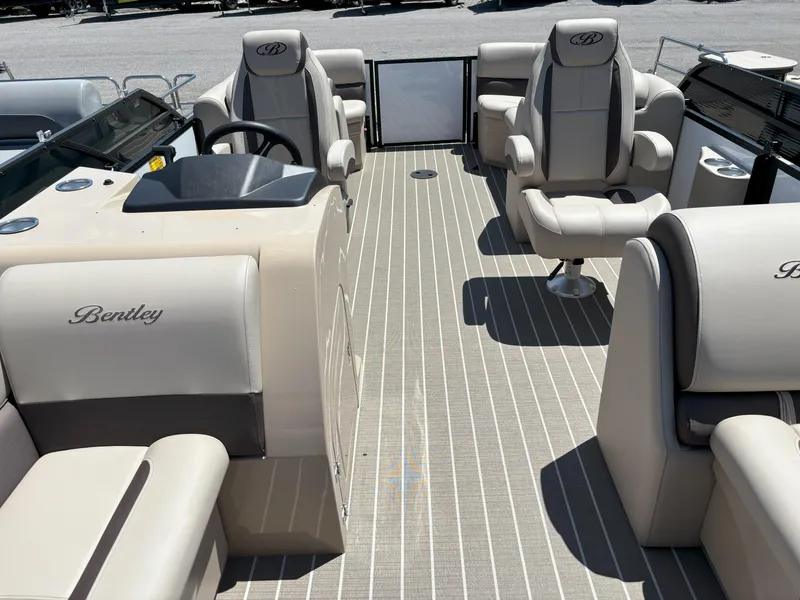 Slide: The Image of 2025 Bentley Pontoons Legacy 223 Navigator interior with luxurious seating and helm. - 19