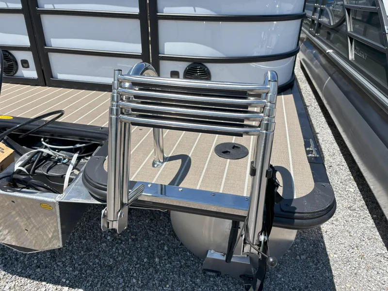 Slide: The Image of 2025 Bentley Pontoons Legacy 223 Navigator with stainless steel ladder on deck. - 22