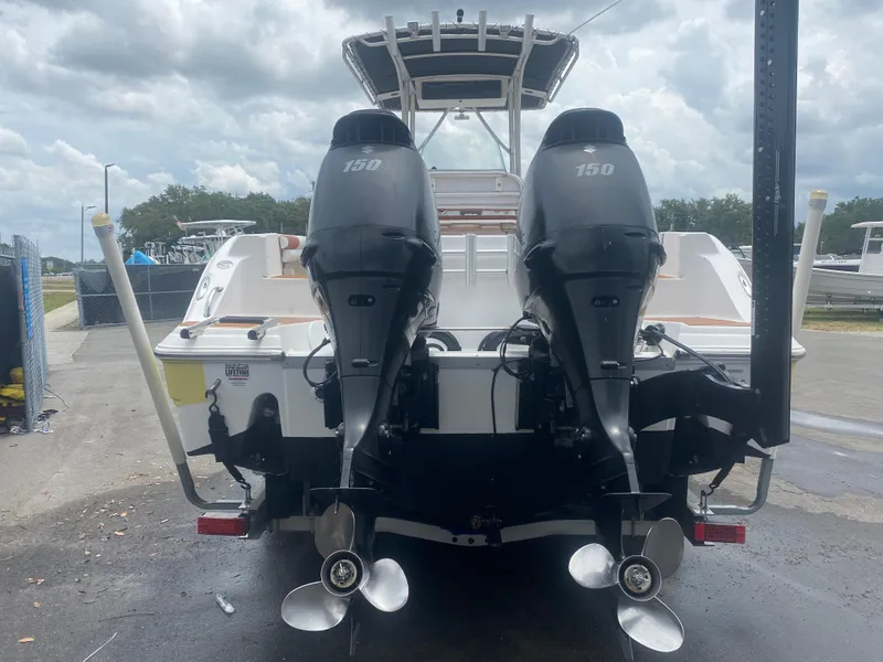 Slide: The Image of 2007 Sea Fox 256 CC boat with dual 150 horsepower outboard engines, rear view. - 11