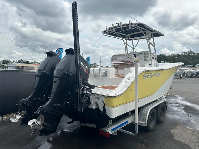 Slide: The Image of 2007 Sea Fox 256 CC boat with dual Suzuki outboard motors on a trailer. - 12