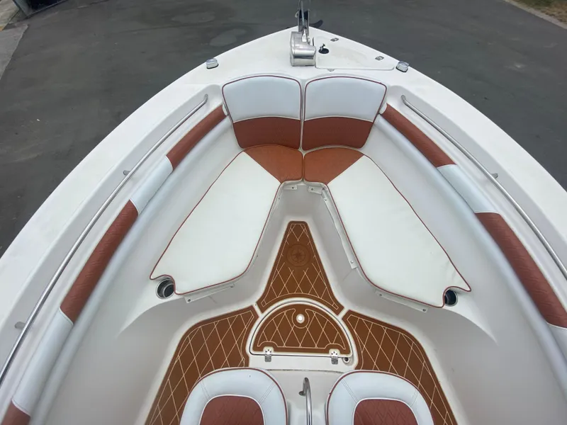 Slide: The Image of 2007 Sea Fox 256 CC boat interior with cushioned seating and deck. - 25