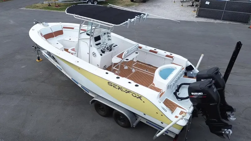 Slide: The Image of 2007 Sea Fox 256 CC boat with dual Suzuki engines on a trailer. - 4