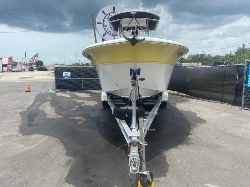 Slide: The Image of 2007 Sea Fox 256 CC boat on trailer, parked outdoors under cloudy sky. - 5