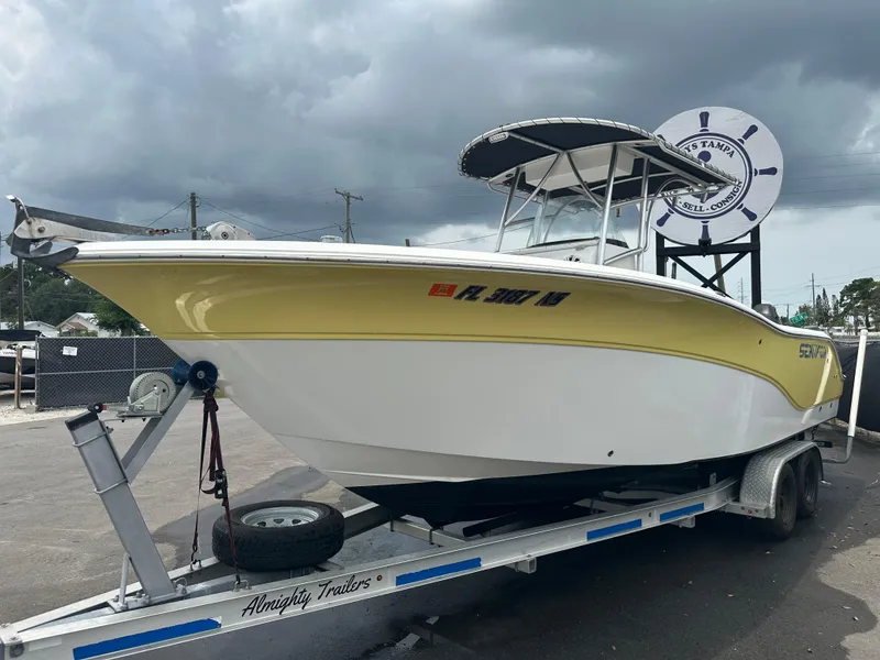 Slide: The Image of 2007 Sea Fox 256 CC boat on trailer under cloudy sky. - 7