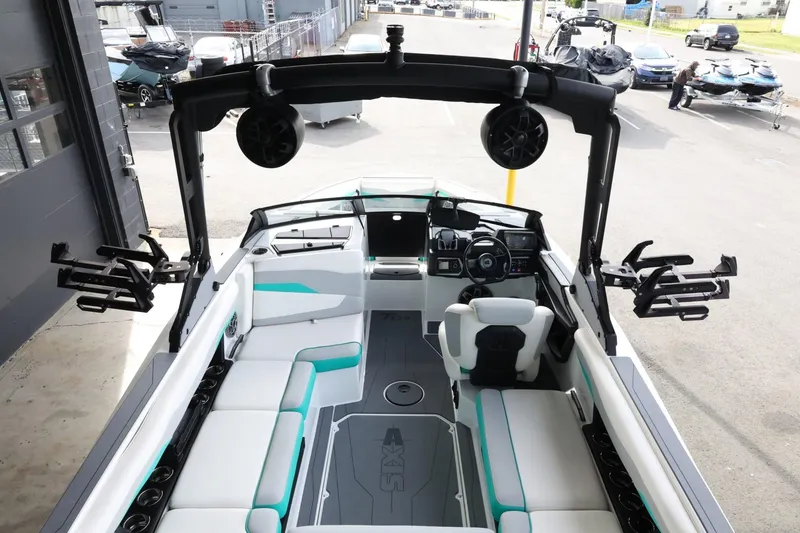 Slide: The Image of 2023 Axis T220 boat interior with modern seating and advanced controls. - 11