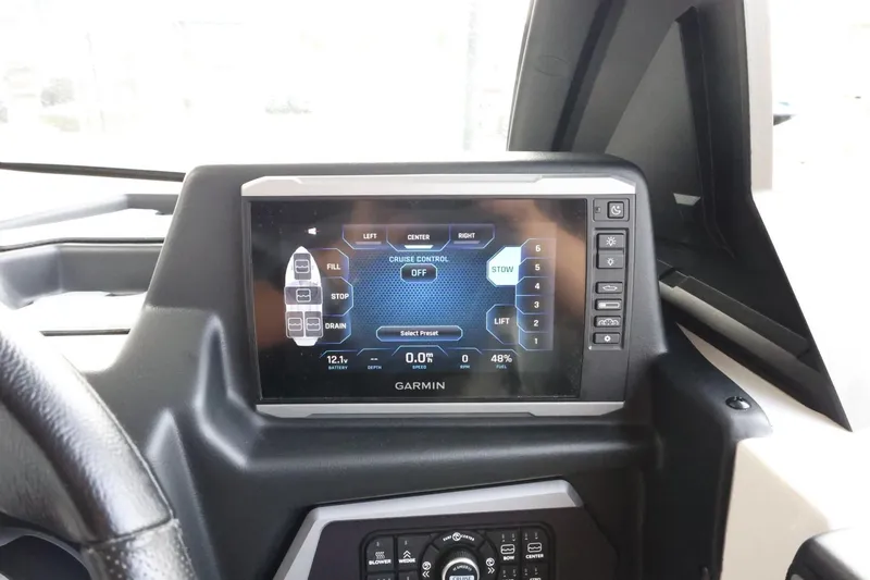 Slide: The Image of Garmin display on 2023 Axis T220 boat dashboard, showing cruise control settings. - 22