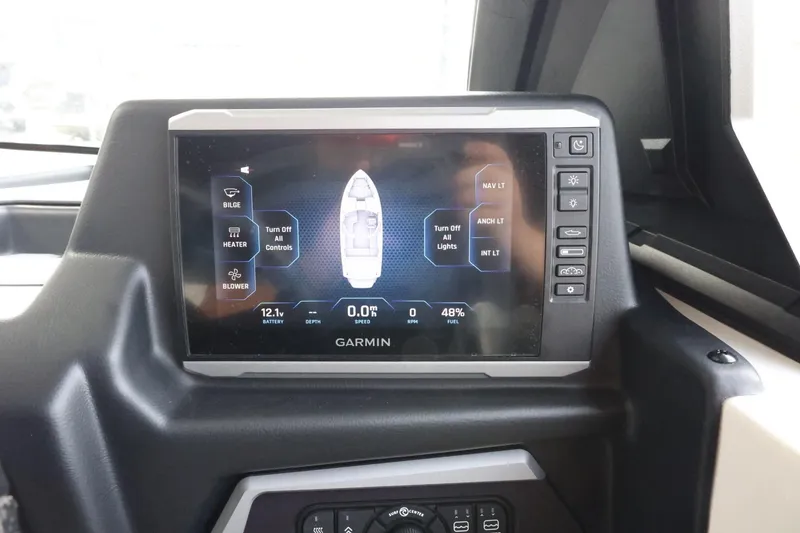 Slide: The Image of Garmin display on 2023 Axis T220 boat dashboard showing navigation and control interface. - 23