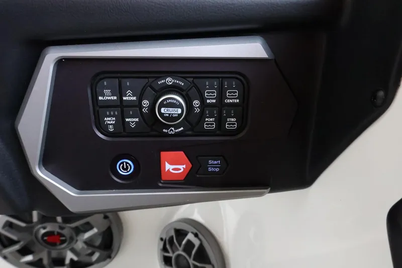 Slide: The Image of Control panel of 2023 Axis T220 boat with various function buttons and dials. - 25