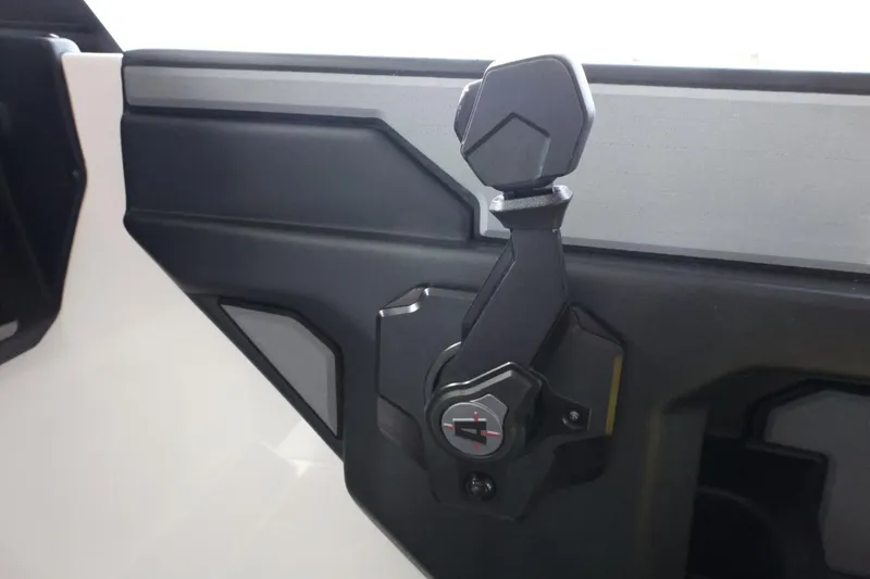 Slide: The Image of 2023 Axis T220 boat throttle control lever, featuring a sleek black design. - 27