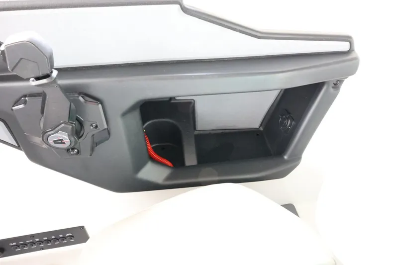 Slide: The Image of 2023 Axis T220 boat dashboard with storage compartment and cup holder. - 31