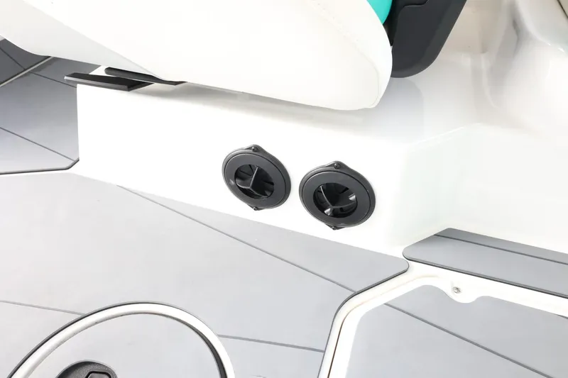 Slide: The Image of 2023 Axis T220 boat interior with dual cup holders and sleek design. - 33