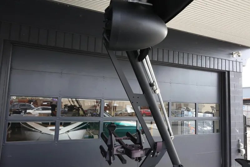 Slide: The Image of 2023 Axis T220 boat tower with wakeboard rack in a garage setting. - 36