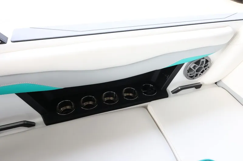 Slide: The Image of 2023 Axis T220 boat interior with cup holders and speaker. - 42
