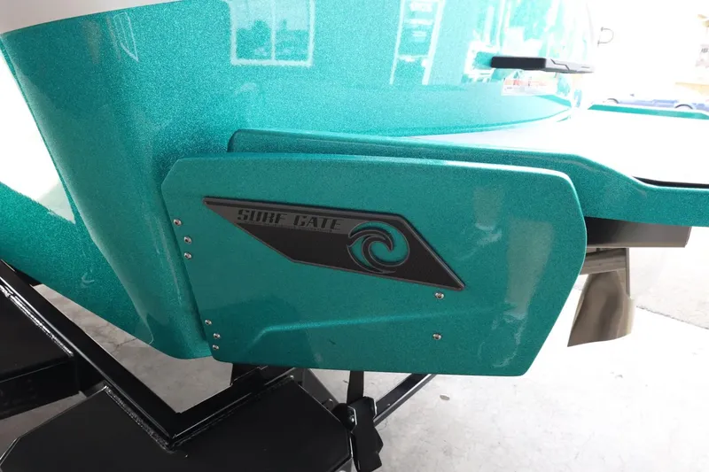 Slide: The Image of 2023 Axis T220 boat with teal Surf Gate feature, enhancing wakeboarding performance. - 46
