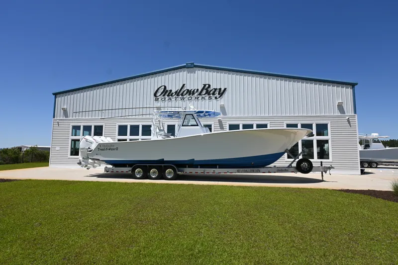 Slide: The Image of 2022 Onslow Bay 41 boat in front of Onslow Bay Boatworks building. - 1