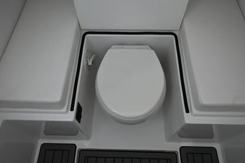 Slide: The Image of 2022 Onslow Bay 41 boat interior with a modern marine toilet. - 12