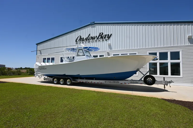 Slide: The Image of 2022 Onslow Bay 41 boat on trailer outside Onslow Bay Boatworks building. - 2