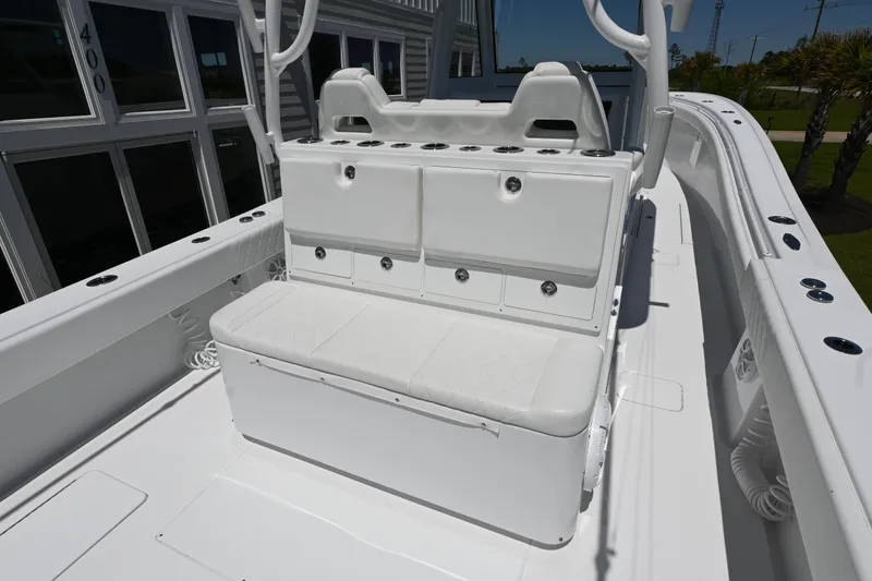 Slide: The Image of 2022 Onslow Bay 41 boat interior with white seating and storage compartments. - 5