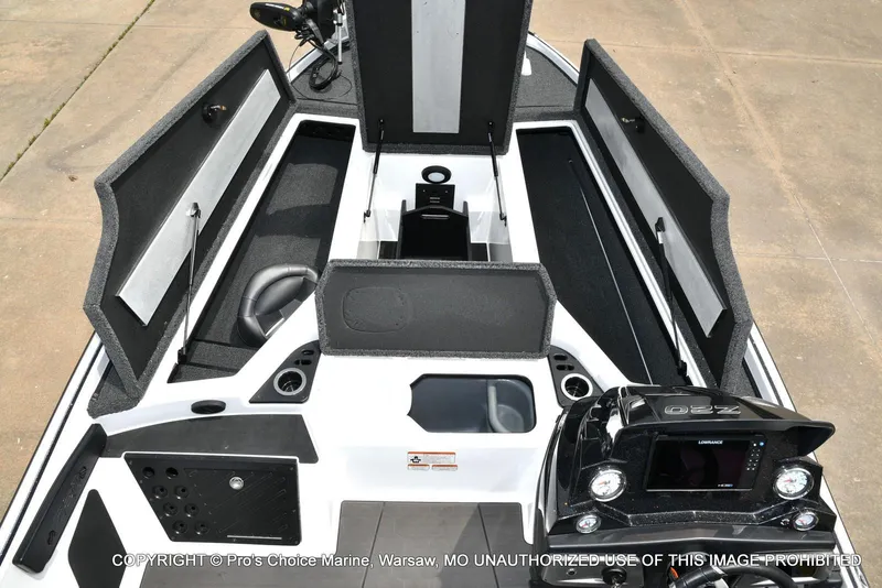 Slide: The Image of 2024 Nitro Z20 Pro boat interior with open storage compartments and control panel. - 11
