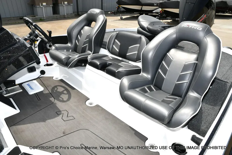 Slide: The Image of 2024 Nitro Z20 Pro boat interior with sleek, modern seating and steering wheel. - 15