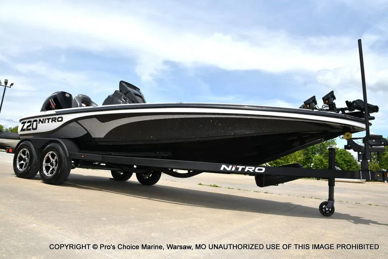 Slide: The Image of 2024 Nitro Z20 Pro boat on trailer, sleek design, black and white color scheme. - 16