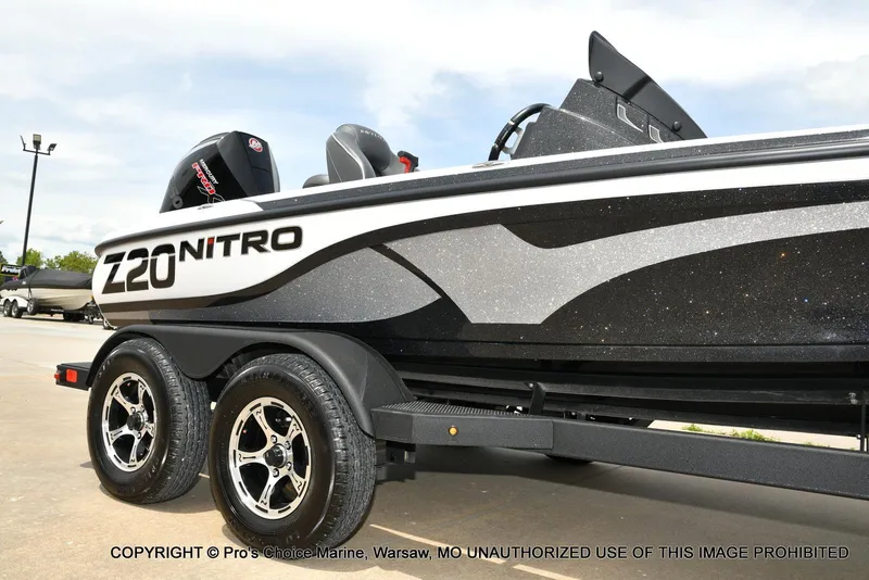 Slide: The Image of 2024 Nitro Z20 Pro boat on trailer, featuring sleek design and dual wheels. - 17