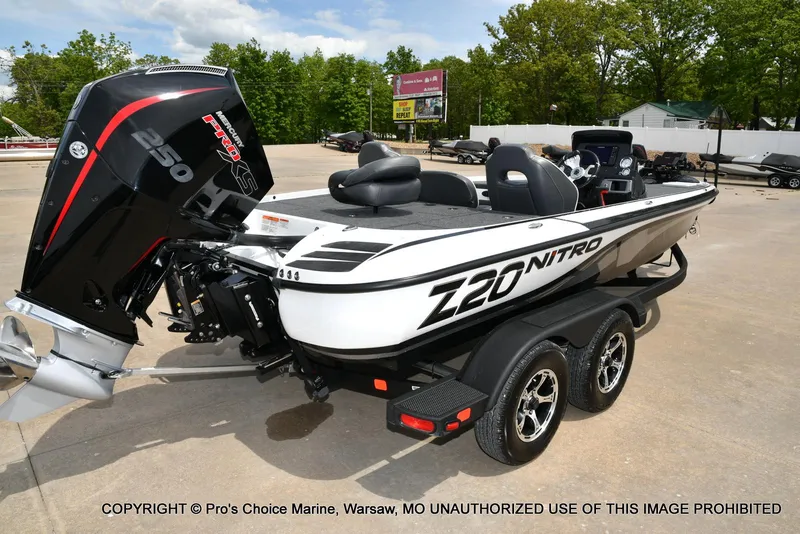 Slide: The Image of 2024 Nitro Z20 Pro boat with powerful 250 horsepower engine, parked on a trailer. - 18