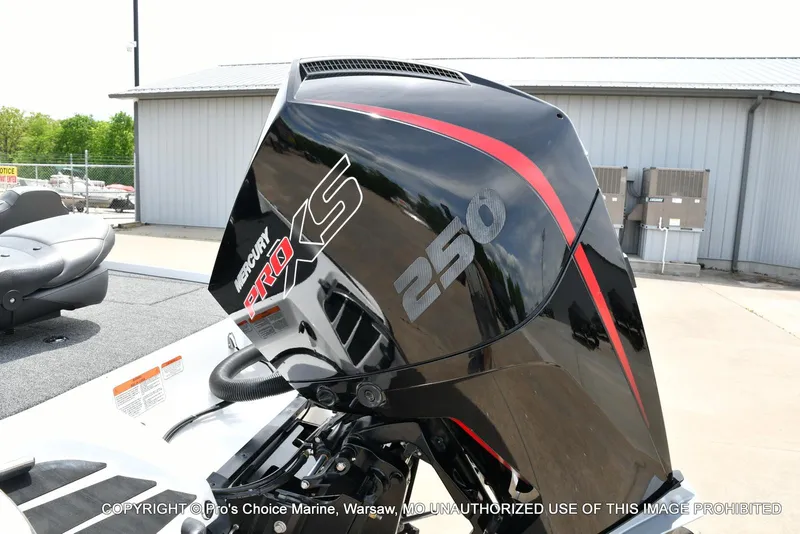 Slide: The Image of 2024 Nitro Z20 Pro boat with Mercury Pro XS 250 engine, parked outdoors. - 25