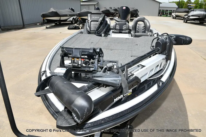 Slide: The Image of 2024 Nitro Z20 Pro fishing boat with advanced equipment, parked outdoors. - 31