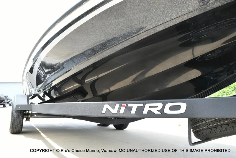Slide: The Image of 2024 Nitro Z20 Pro boat on trailer, close-up view of sleek hull design. - 34