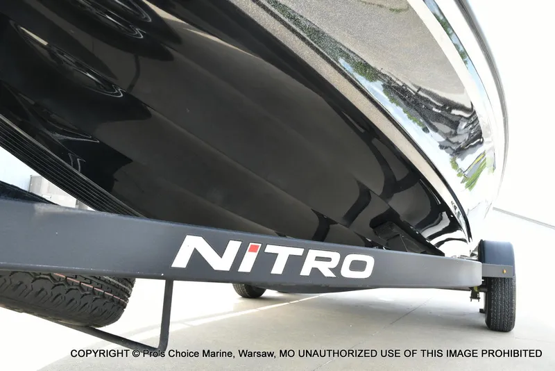 Slide: The Image of 2024 Nitro Z20 Pro boat on trailer, showcasing sleek black hull design. - 35