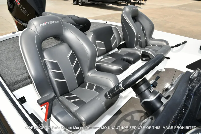 Slide: The Image of 2024 Nitro Z20 Pro boat interior with sleek gray seating and steering wheel. - 38