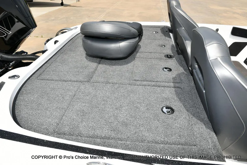 Slide: The Image of 2024 Nitro Z20 Pro boat with gray carpeted deck and cushioned seats. - 39