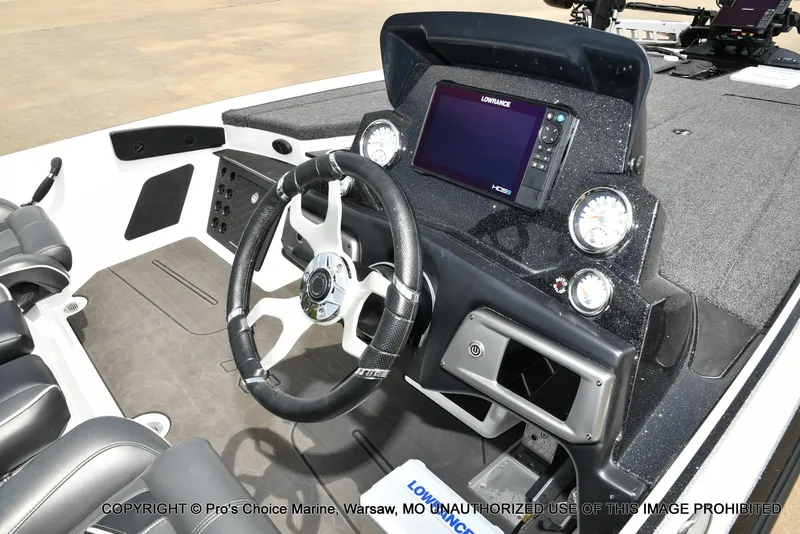 Slide: The Image of 2024 Nitro Z20 Pro boat dashboard with steering wheel and navigation system. - 40