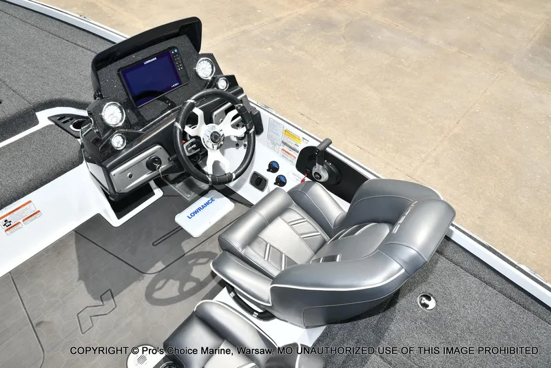 Slide: The Image of 2024 Nitro Z20 Pro boat cockpit with steering wheel, control panel, and comfortable seating. - 43