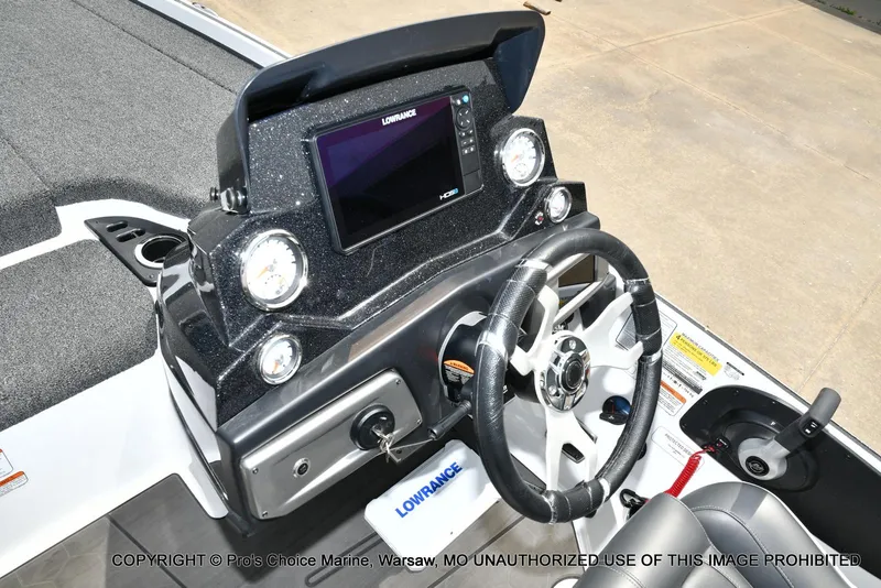 Slide: The Image of 2024 Nitro Z20 Pro boat dashboard with steering wheel and Lowrance display. - 45