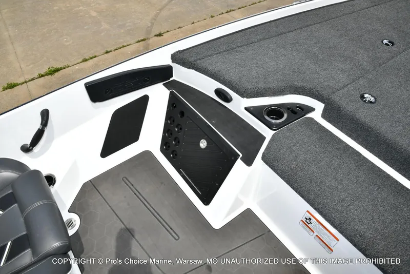 Slide: The Image of 2024 Nitro Z20 Pro boat interior with carpeted deck and seating area. - 48
