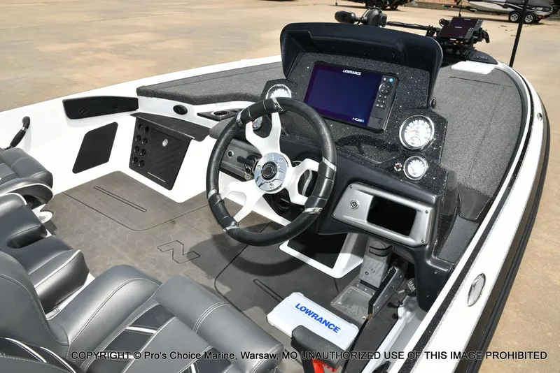 Slide: The Image of 2024 Nitro Z20 Pro boat cockpit with steering wheel and Lowrance display. - 6