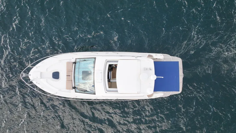 Slide: The Image of Aerial view of 2017 Sea Ray 350 Coupe yacht on open water. - 5